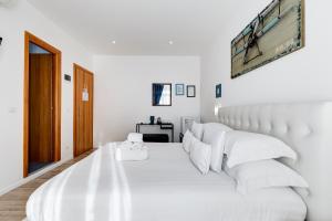 Postel nebo postele na pokoji v ubytování Ripetta Central Suites
