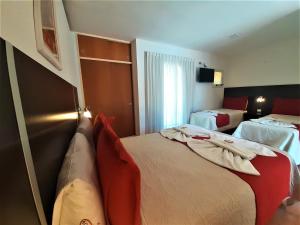 Ένα ή περισσότερα κρεβάτια σε δωμάτιο στο Hosteria Aguaribay +39 φωτογραφίες