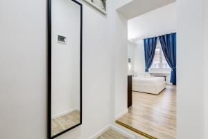 Postel nebo postele na pokoji v ubytování Ripetta Central Suites