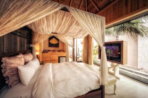Bali Motel - Zhongli tesisinde bir odada yatak veya yataklar