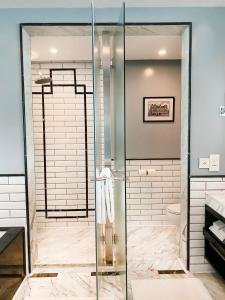 a shower with a glass door in a bathroom at InterContinental Marine Drive Mumbai, an IHG Hotel in Mumbai