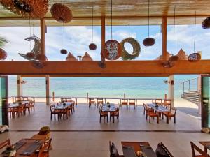 Ein Restaurant oder anderes Speiselokal in der Unterkunft Mimosa Resort & Spa 