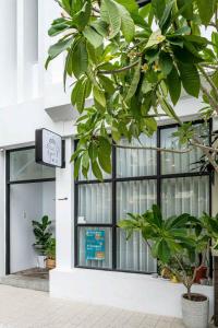 a building with a window with plants in front of it at 鄢室民宿 in Hualien City