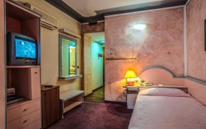Postel nebo postele na pokoji v ubytování Hotel Grazia Deledda