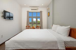 Una cama o camas en una habitación de Bamboo Hotel