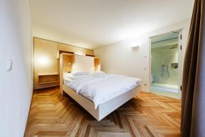 Postel nebo postele na pokoji v ubytování Gourmet - Boutique Hotel Tanzer