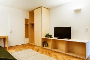 TV a/nebo společenská místnost v ubytování Gourmet - Boutique Hotel Tanzer