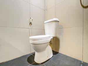 a bathroom with a toilet in a room at OYO Capital O 90081 Pondok Sabaraya 2 Syariah in Cikampek