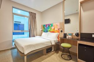 Postel nebo postele na pokoji v ubytování ibis budget Singapore Clarke Quay