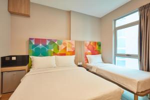 Postel nebo postele na pokoji v ubytování ibis budget Singapore Clarke Quay