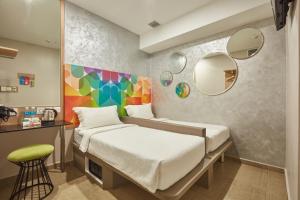 Postel nebo postele na pokoji v ubytování ibis budget Singapore Clarke Quay