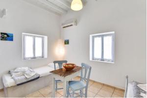 Postel nebo postele na pokoji v ubytování Traditional Cycladic House