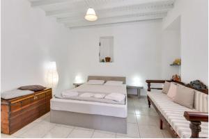 Postel nebo postele na pokoji v ubytování Traditional Cycladic House