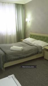 Katil atau katil-katil dalam bilik di Makenty House Astana