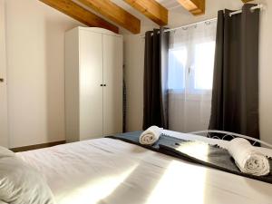 Posteľ alebo postele v izbe v ubytovaní Vila Badalona