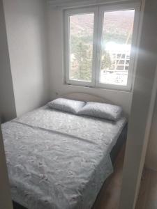 Postel nebo postele na pokoji v ubytování Apartmani Anja