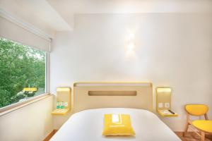 Letto o letti in una camera di bloomrooms @ Janpath