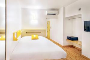 Letto o letti in una camera di bloomrooms @ Janpath