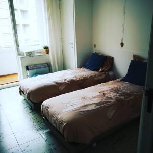 Postel nebo postele na pokoji v ubytování Fleuri Westende