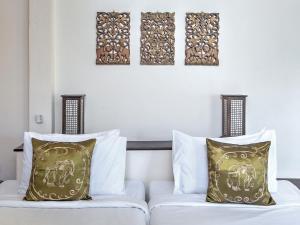 Ein Bett oder Betten in einem Zimmer der Unterkunft Khanom Hill Resort