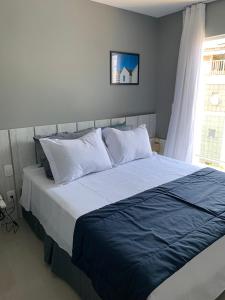 A bed or beds in a room at Flat Edifício Royale 305