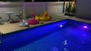 a swimming pool with a toy in the middle of it at PP Nongkhai Resort in Nong Khai