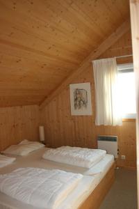 เตียงในห้องที่ My Chalet In Murau