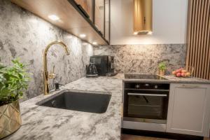 Η κουζίνα ή μικρή κουζίνα στο Apartament Warmiński by RENT4YOU