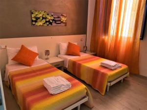 A bed or beds in a room at Le casette del generale