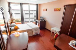 Postel nebo postele na pokoji v ubytování Hotel Sarah Nui