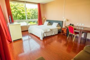 Postel nebo postele na pokoji v ubytování Hotel Sarah Nui