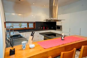 a kitchen with a table with a pink counter top at Luxury houses in Dobrinishte in Dobrinishte