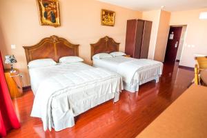 Postel nebo postele na pokoji v ubytování Hotel Sarah Nui