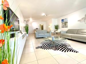 a living room with a zebra on the floor at Luxury Suite Koksijde 201 - Adult Only in Koksijde