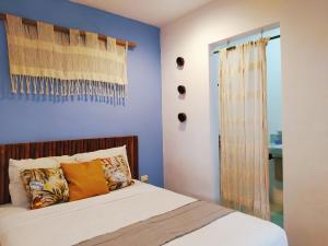 מיטה או מיטות בחדר ב-Hotel Jardin Mahahual
