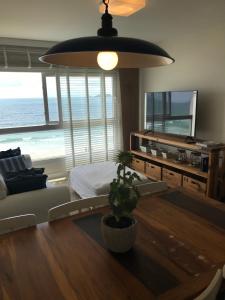 Et tv og/eller underholdning på Alto Padrão Pé na Areia 2