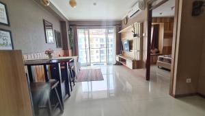 a large room with a kitchen and a living room at Gateway Pasteur 2 BR tower depan Jade 11 C in Bandung