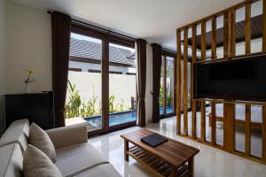 Khu vực ghế ngồi tại The Calna Villa Bali