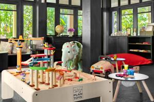 a play room with a table and toys in it at Anantara Lawana Koh Samui Resort in Chaweng