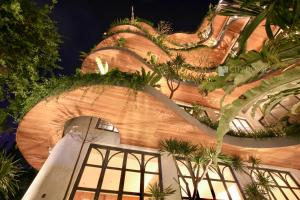 a building with plants on the side of it at CityHouse VIBE City Oasis in Ho Chi Minh City