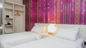 Postel nebo postele na pokoji v ubytování Alam Hotel by Cordela