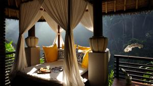 a table that has some chairs and umbrellas on it at Maya Ubud Resort & Spa in Ubud