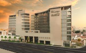 een weergave van een gebouw met een bord erop bij dusitD2 Salwa Doha in Doha