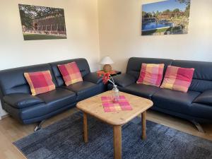a living room with a couch and a table at Fewo Haus Piepenbreier in Bad Sassendorf