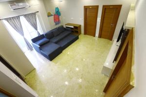 TV in/ali zabaviščno središče v nastanitvi Classio Residency