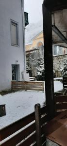 a view of a building with snow on the ground at Studio idéalement situé in Cauterets