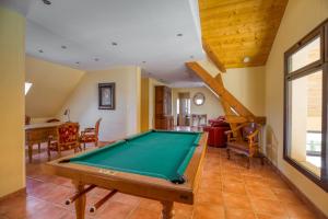 a living room with a pool table in it at Maison confortable avec piscine à Villentrois-Faverolles 250m² in Faverolles