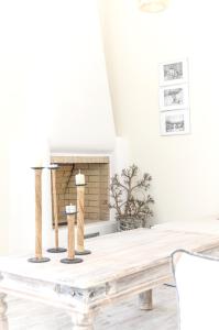 a dining room table with a fireplace at Spacious Villa in Naxos with Sea View in Naxos Chora