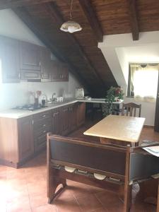 A kitchen or kitchenette at Spacious Apartment in Zafferana Etnea 65 m² with Private Garden