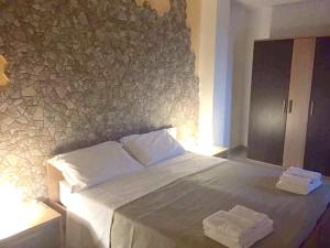 A bed or beds in a room at Spacious Apartment in Zafferana Etnea 65 m² with Private Garden